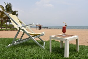 Private beach, free beach cabanas, beach bar, surfing