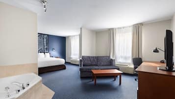 Deluxe Suite, 1 King Bed with Sofa bed | Living area | 32-inch TV with cable channels