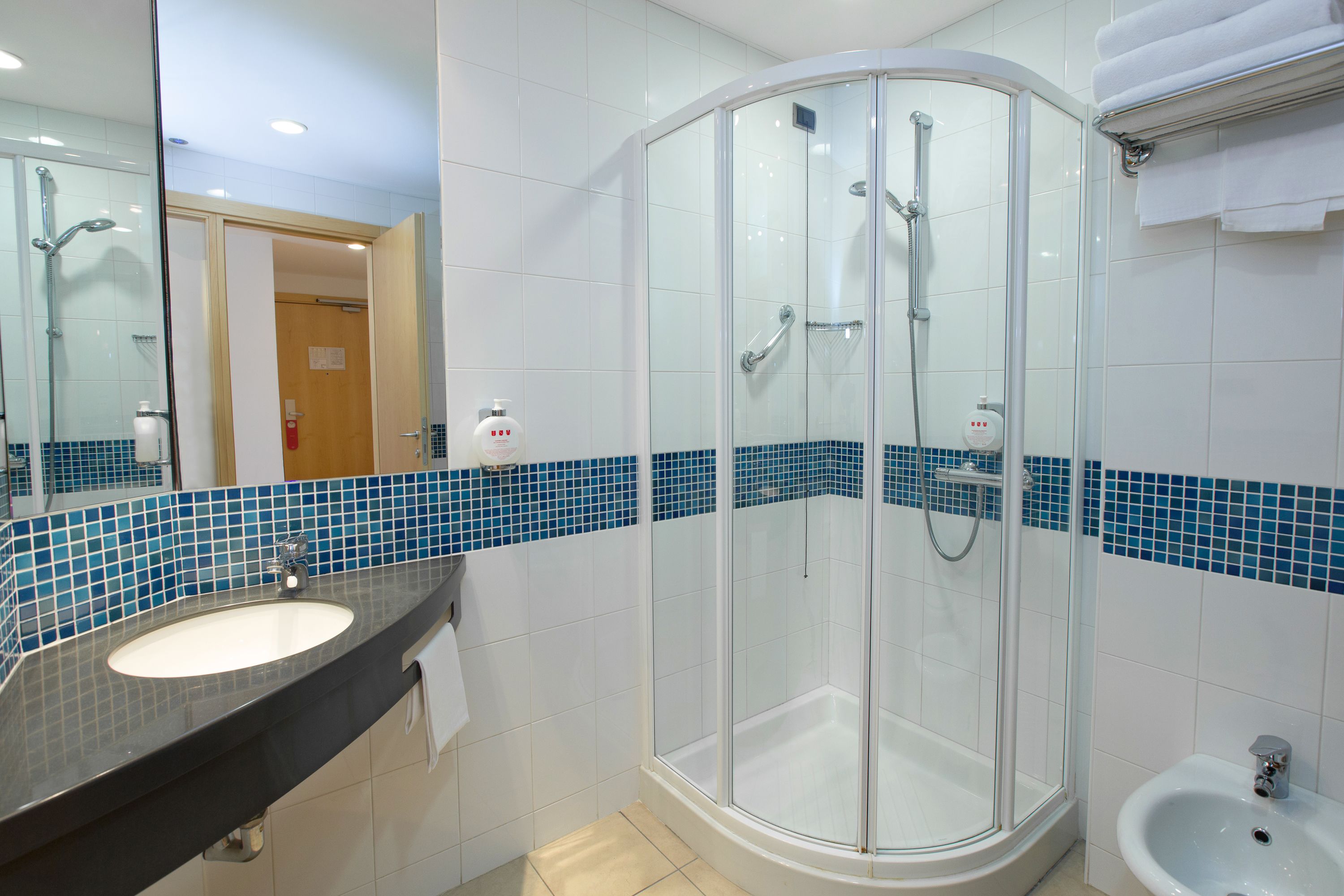 shower, hair dryer, slippers, bidet