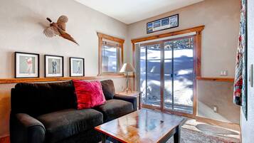 Three-bedroom condo hot tub | Living area | TV, fireplace, DVD player