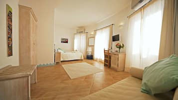 Junior Suite | Sala de estar | Una televisión