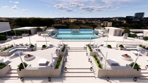 A rooftop pool area with a view of the cityscape, including buildings and greenery. - ENFORD Hotel (Cheongju)