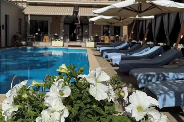 Outdoor pool, open 8:00 AM to 8:00 PM, sun loungers