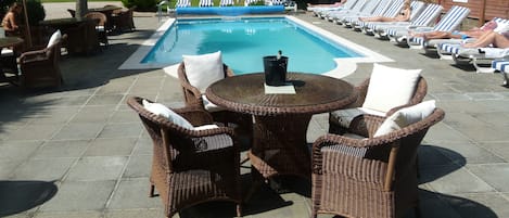 Seasonal outdoor pool, pool loungers