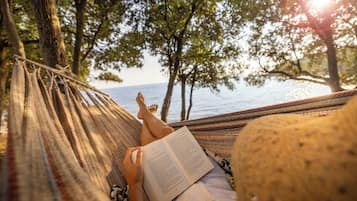 On the beach, sun loungers, beach umbrellas, rowing