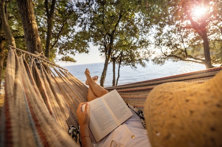On the beach, sun-loungers, beach umbrellas, rowing. Koversada Rooms