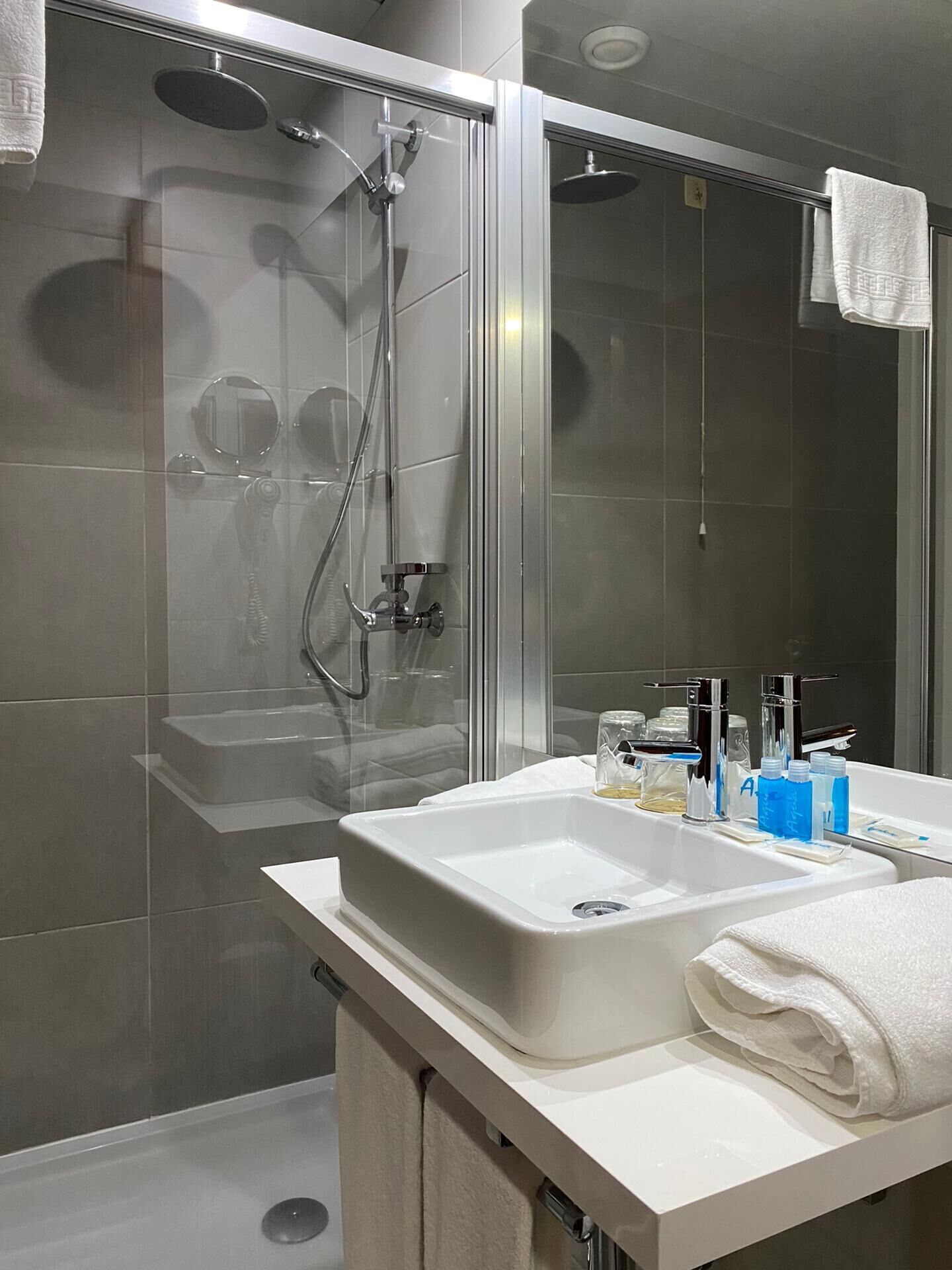 deep-soaking bathtub, rainfall showerhead, free toiletries, hair dryer