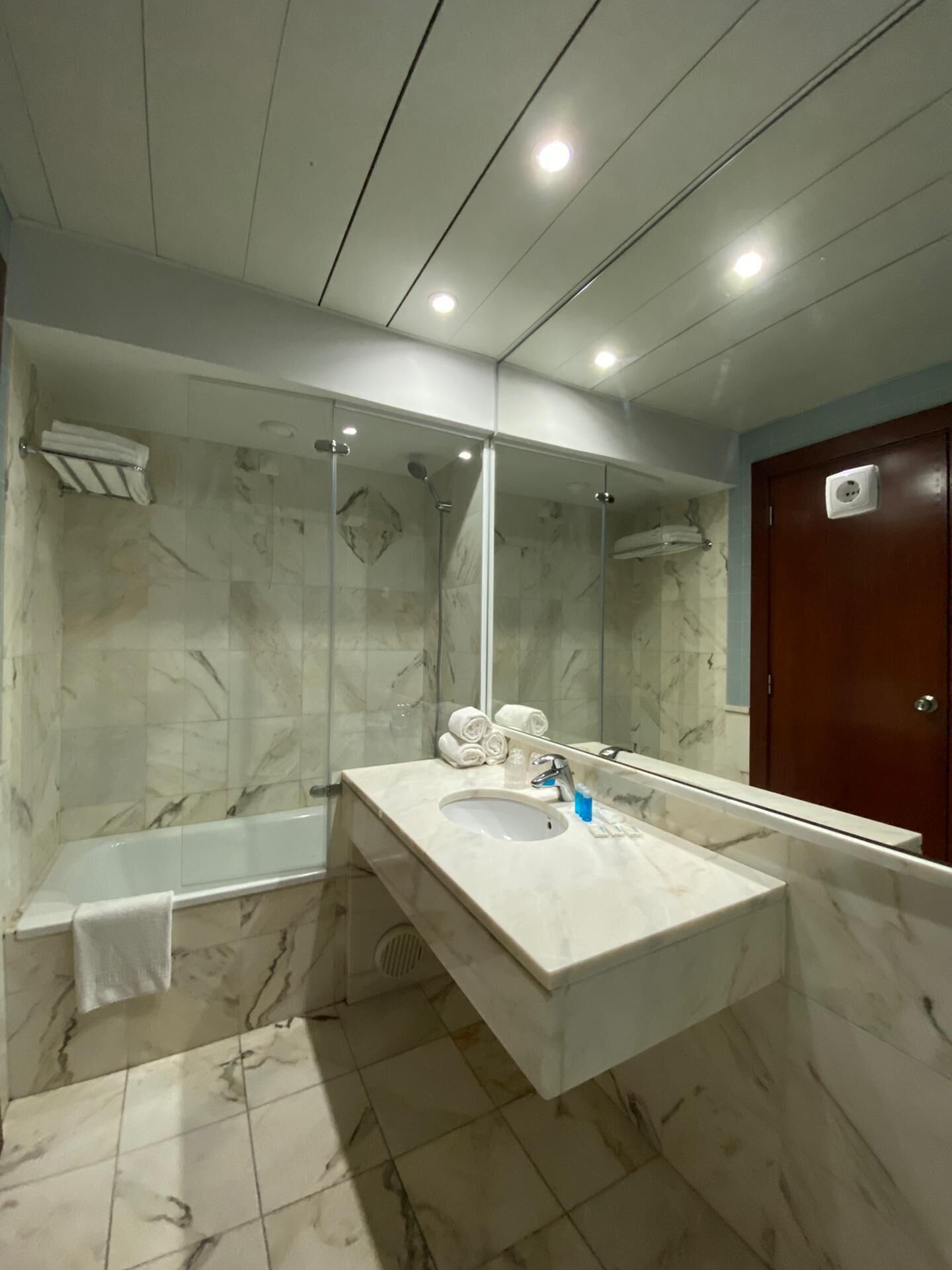 deep-soaking bathtub, rainfall showerhead, free toiletries, hair dryer