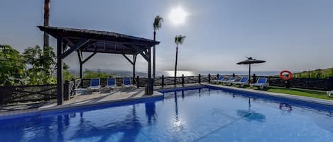 2 outdoor pools, open 10:00 AM to 9:00 PM, pool umbrellas, pool loungers