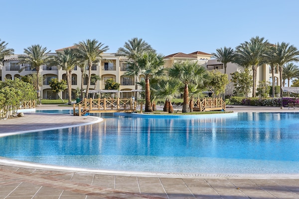 12 outdoor pools, pool umbrellas, sun loungers