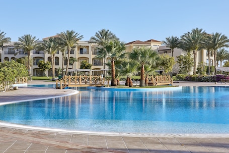 12 outdoor pools, pool umbrellas, sun loungers