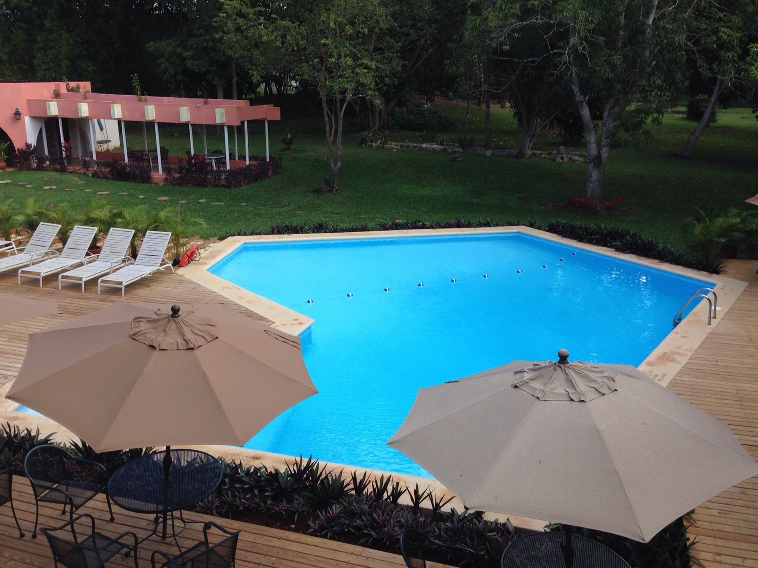 outdoor pool, pool umbrellas, pool loungers