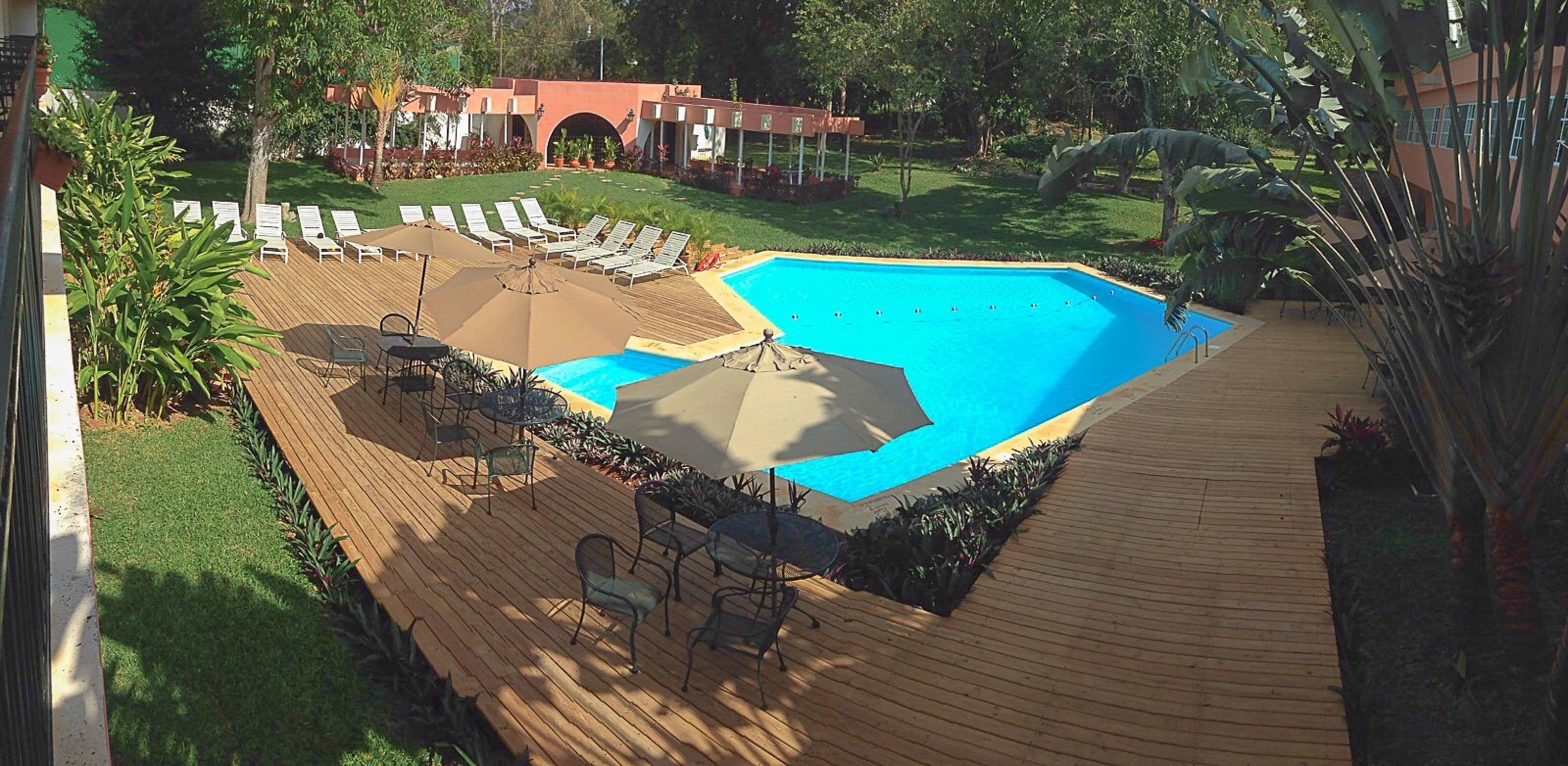 outdoor pool, pool umbrellas, pool loungers