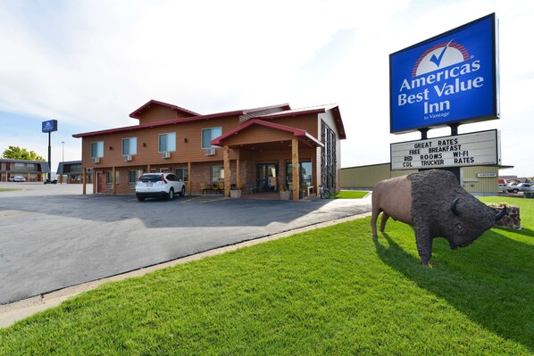 A hotel with a large sign advertising 'Americas Best Value Inn by Vantage'.