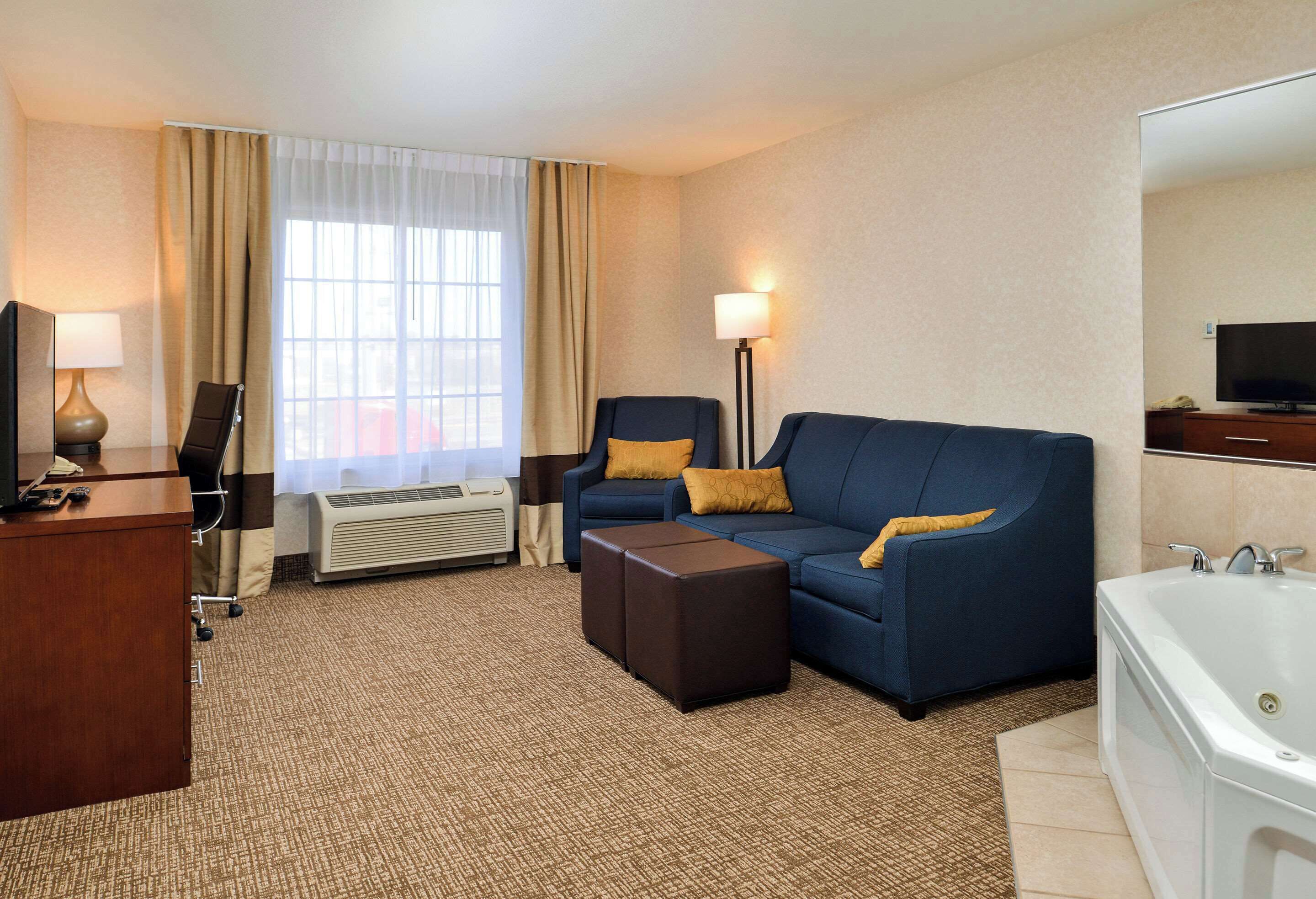 suite, 1 king bed, non smoking | in-room safe, iron/ironing board, cots/infant beds, rollaway beds