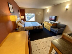 Deluxe Single Room | Living area | 43-inch LED TV with cable channels, TV