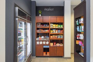 A grocery store interior with refrigerated beverages, snack aisles, and a visible 'market' sign. - Courtyard by Marriott Hanover Lebanon (Lebanon)