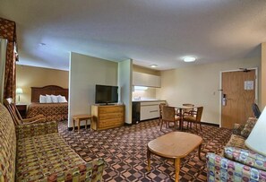 King Bed with two sofa beds and kitchenette | Premium bedding, desk, blackout drapes, free WiFi - Cabot Inn & Suites (Lancaster)