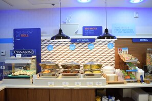 A buffet area with labeled sections for hot food, cereal, and a display of various breakfast items. - Holiday Inn Express Hotel & Suites West I 10 by IHG (Pensacola)