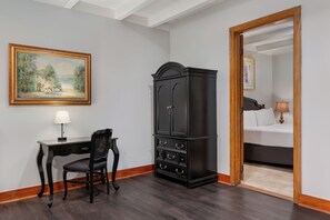 Premium Suite, 1 King Bed | In-room safe, iron/ironing board, Internet, bed sheets - Chateau Hotel (New Orleans)