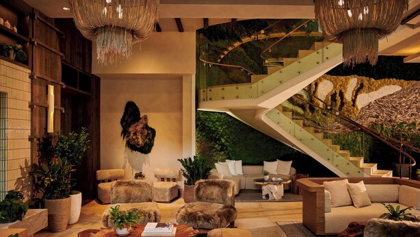 A modern interior with a staircase, seating areas, and a large plant wall. - 1 Hotel Seattle (Seattle)