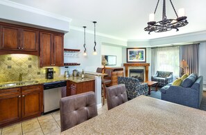 Fridge, microwave, coffee/tea maker, cookware/dishes/utensils