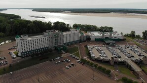 A large hotel with a central tower and a casino.