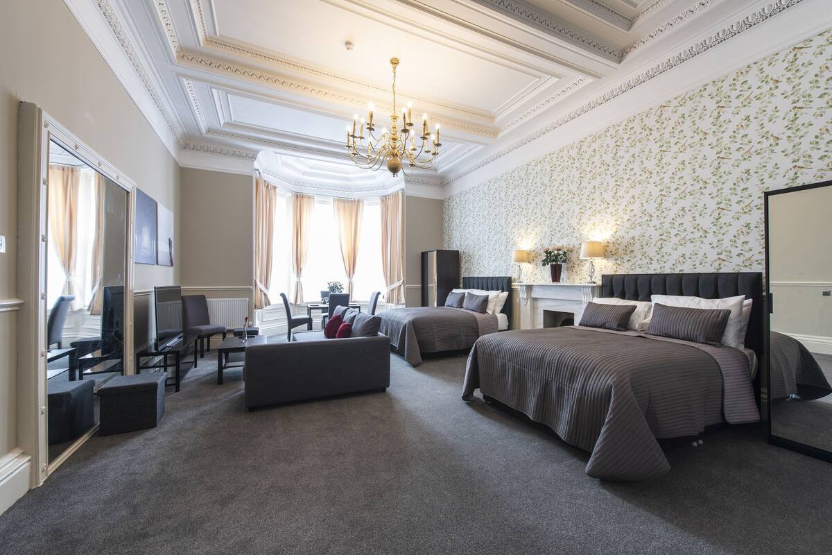 Family Suite, Non Smoking | Iron/ironing board, cribs (free), WiFi (free), individually decorated
