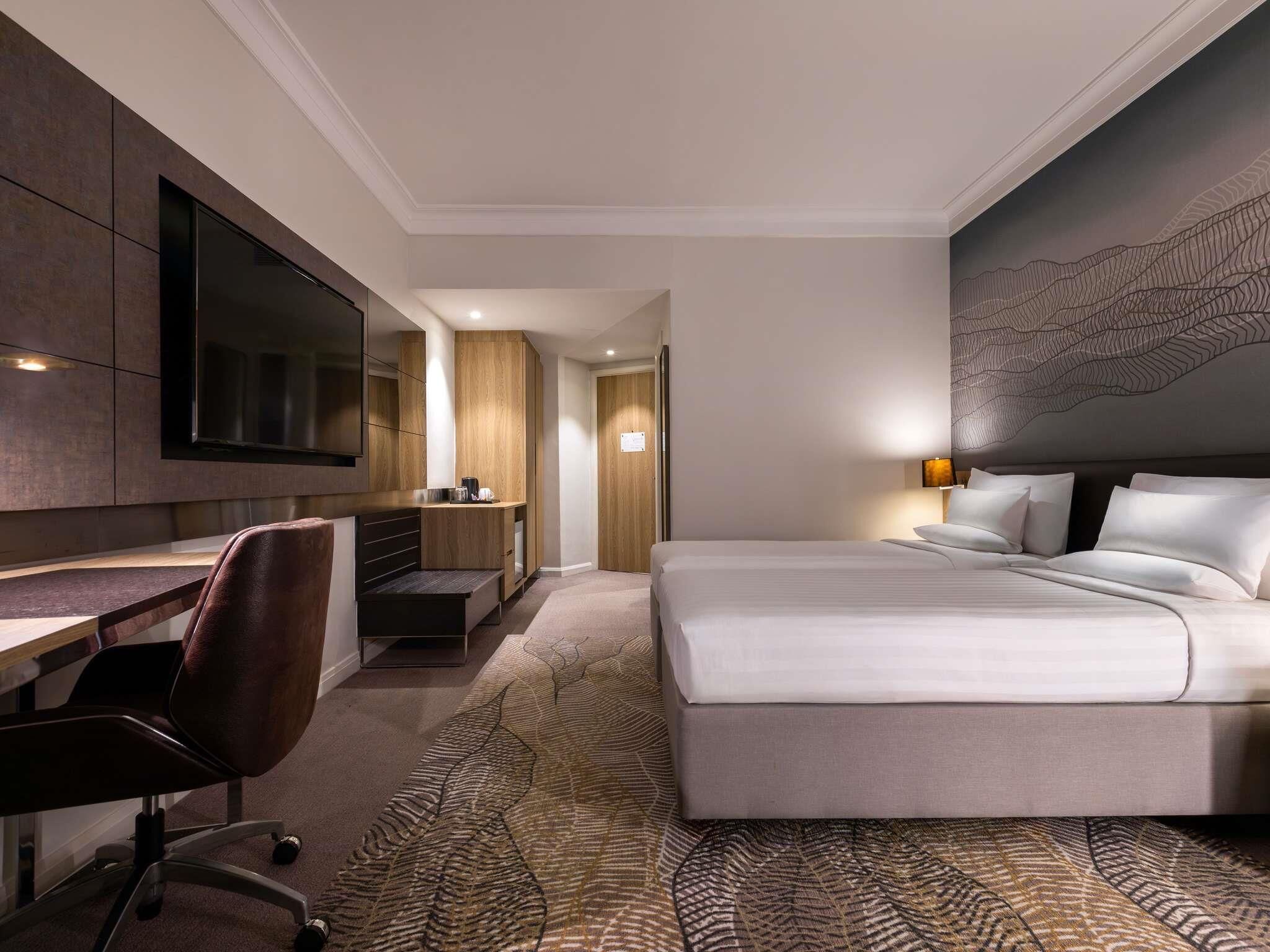 Chambre Premier, 2 lits jumeaux | Minibar, coffre-fort, bureau, rideaux d’obscurcissement