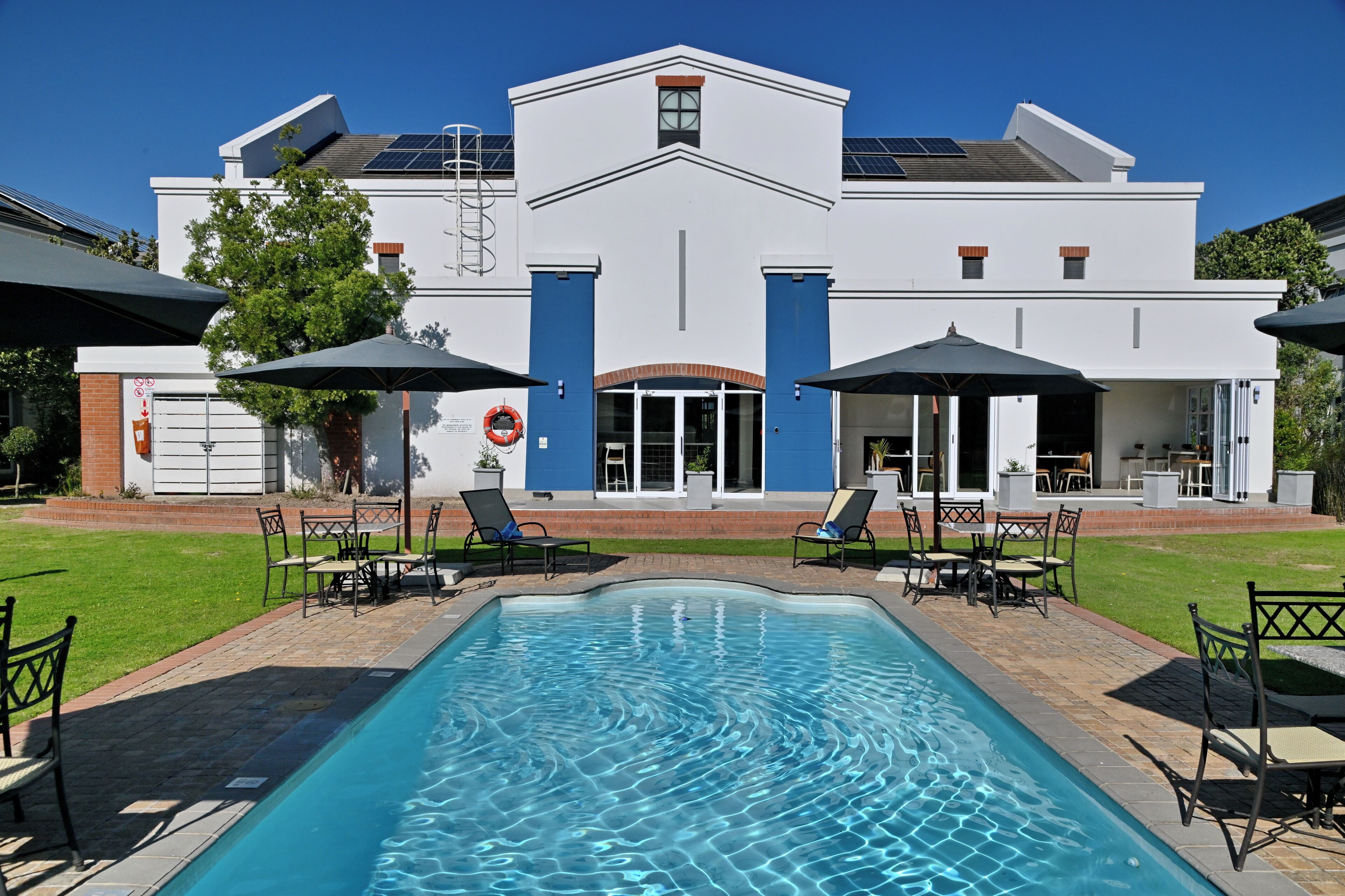 outdoor pool, pool umbrellas, pool loungers