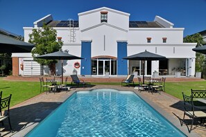 Outdoor pool, pool umbrellas, sun loungers
