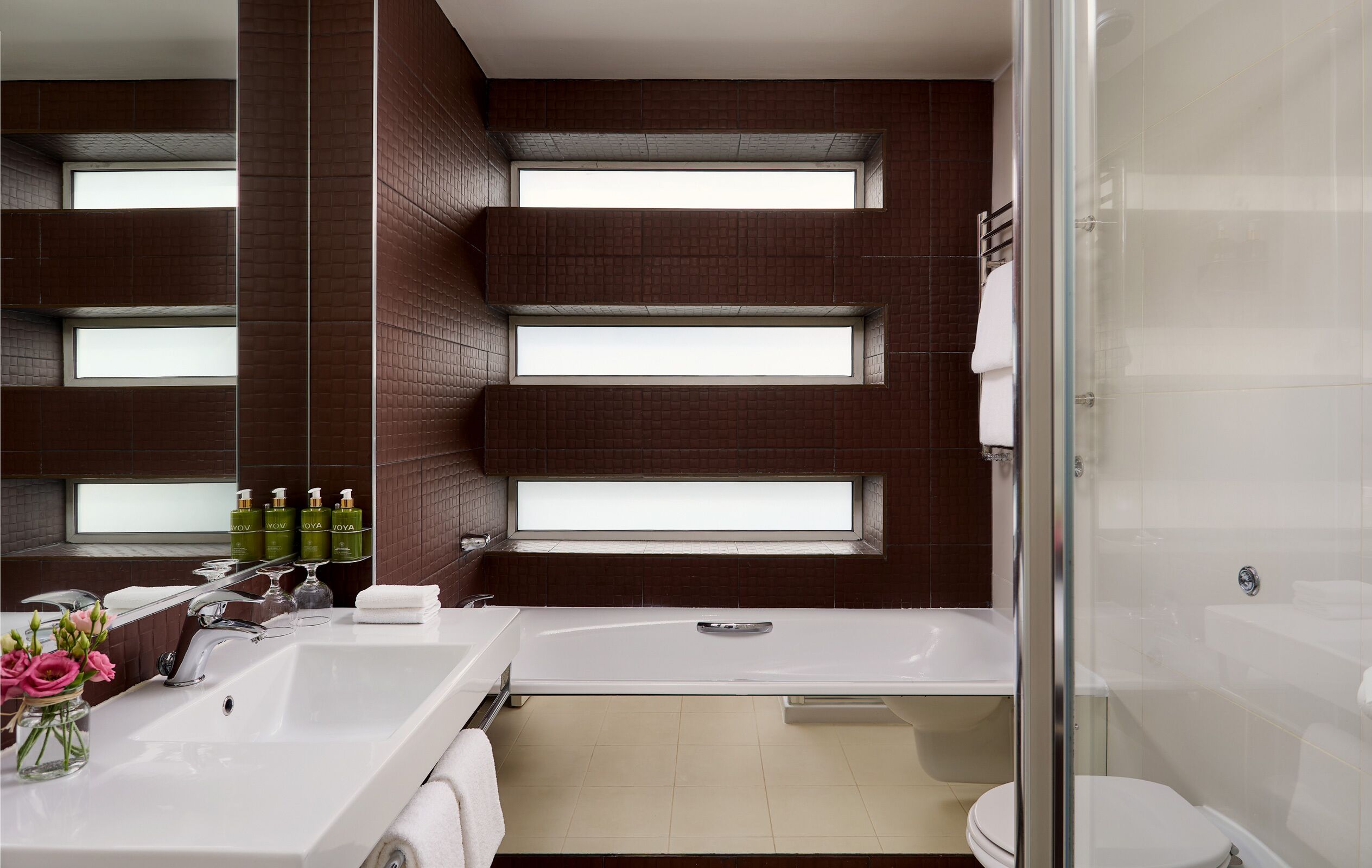 junior suite | bathroom | separate bathtub and shower, free toiletries, hair dryer, towels