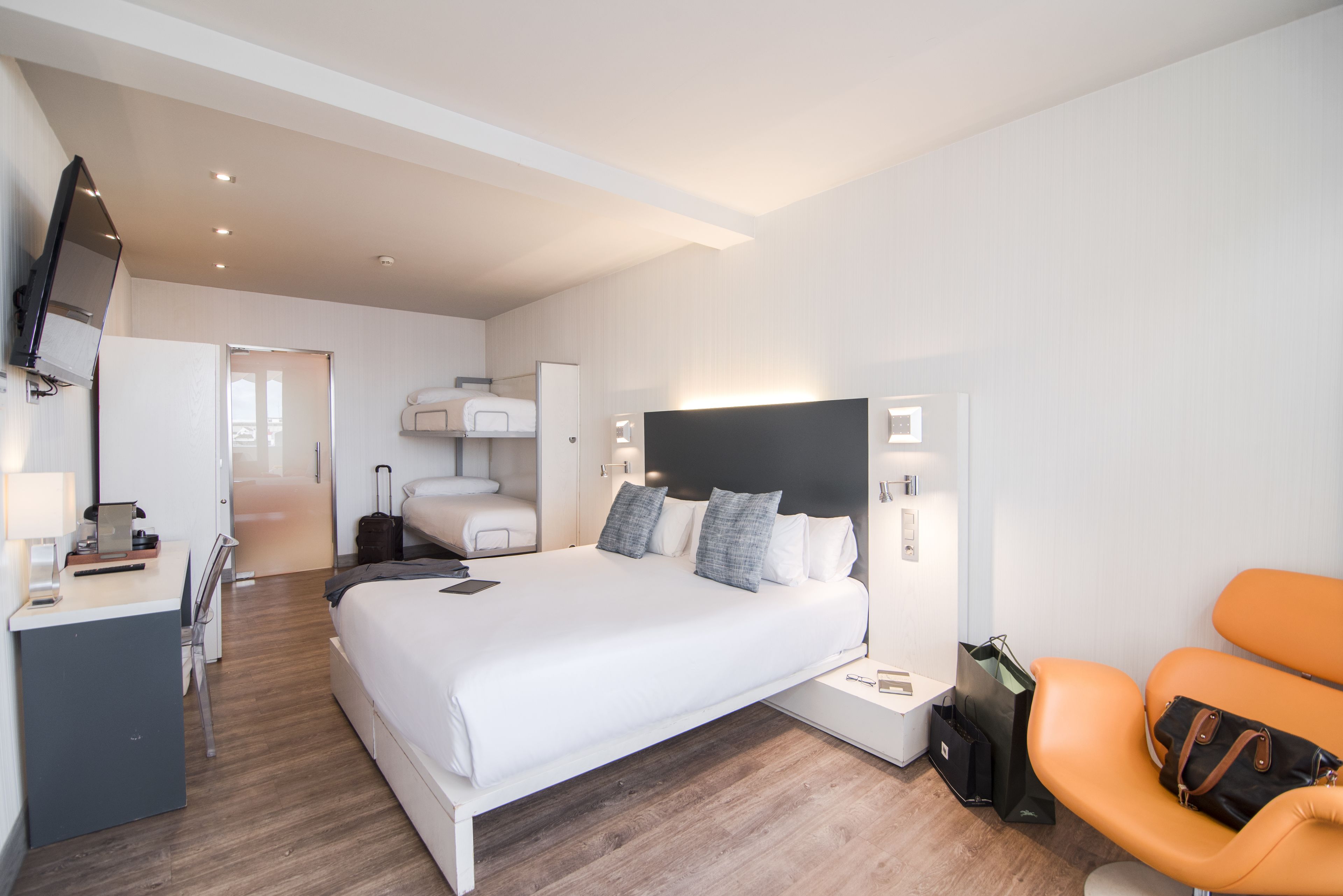 quadruple room, terrace | minibar, in-room safe, desk, iron/ironing board