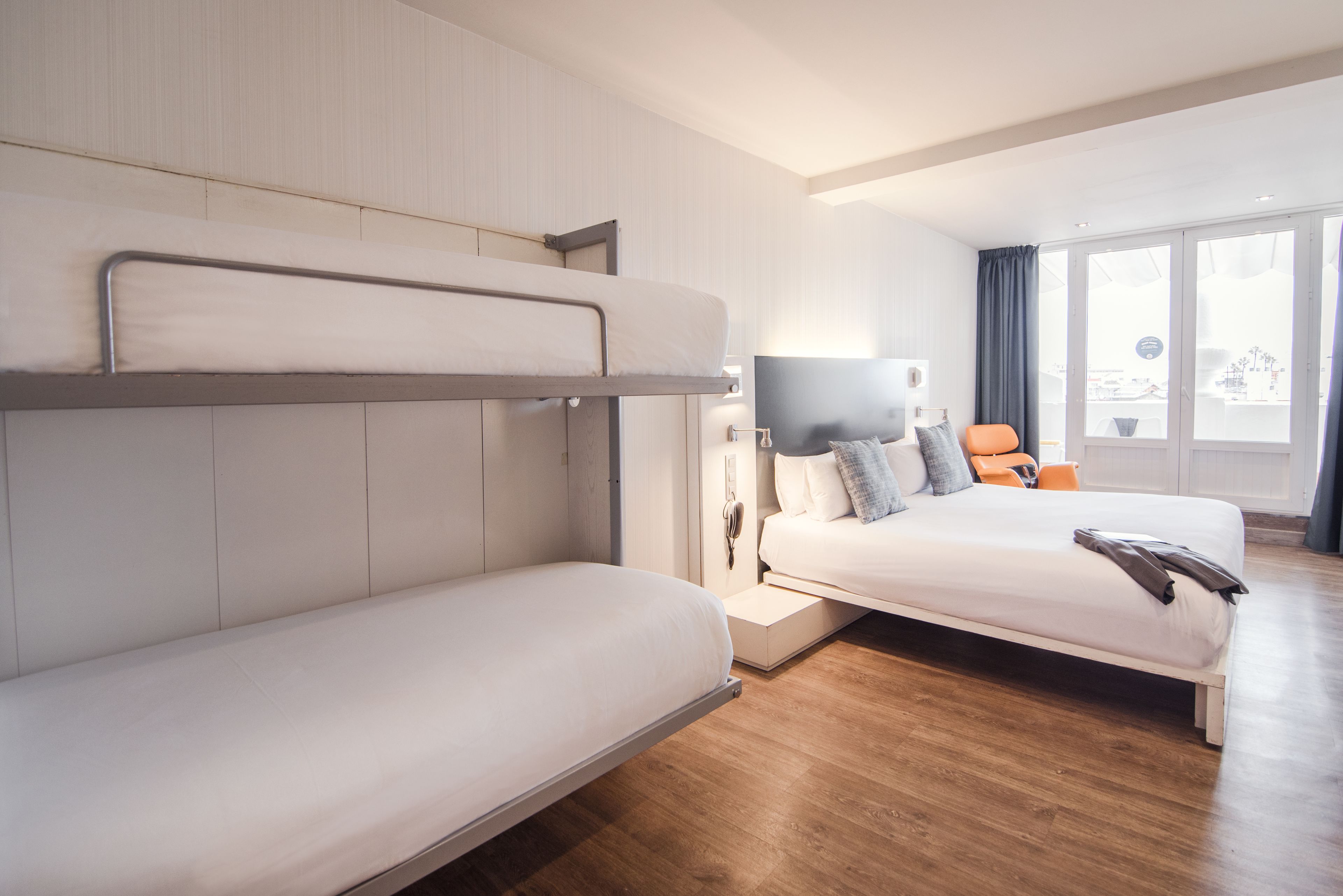 quadruple room, terrace | minibar, in-room safe, desk, iron/ironing board