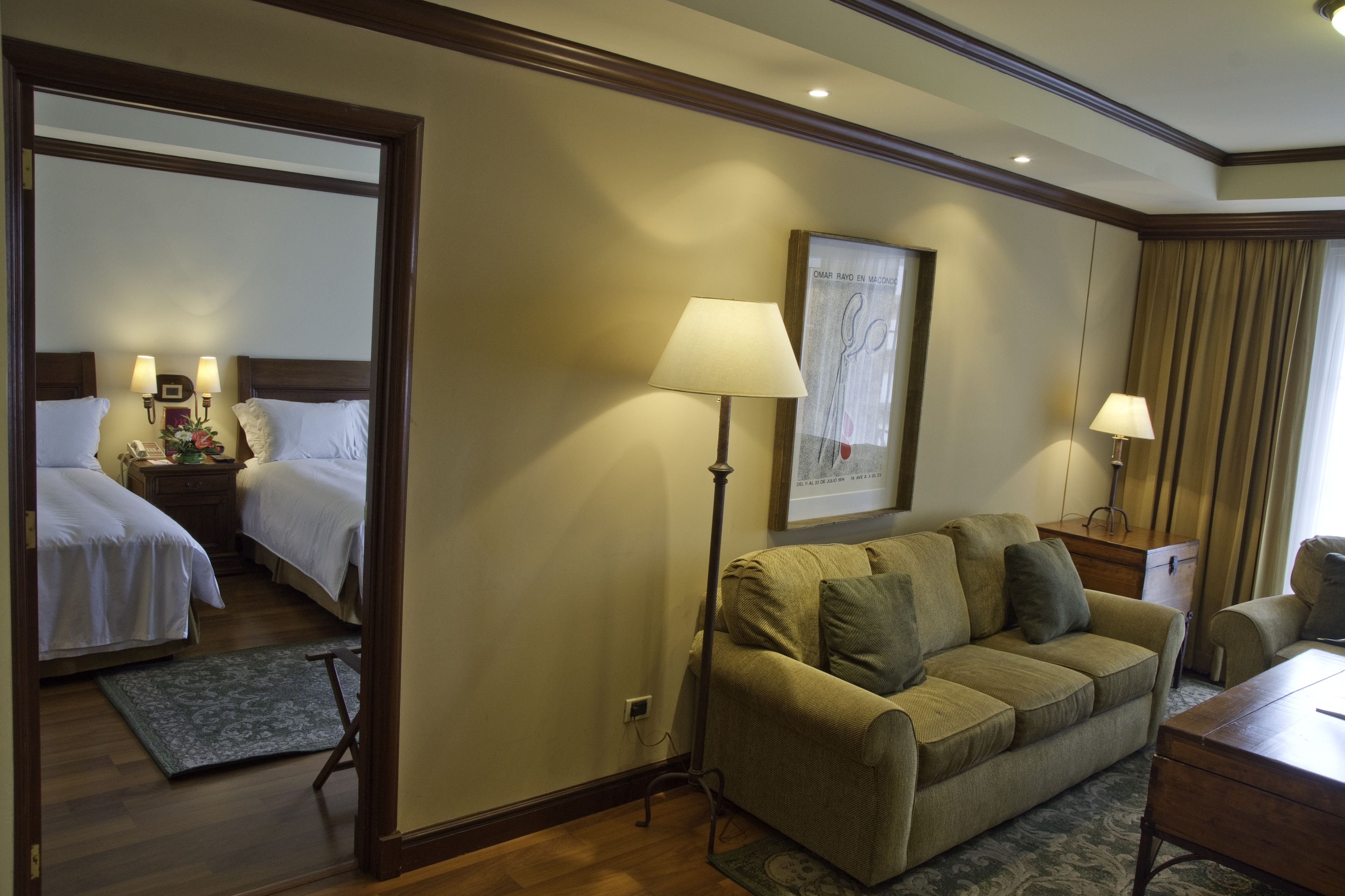 master suite, 2 double beds | living area | 32-inch tv with cable channels