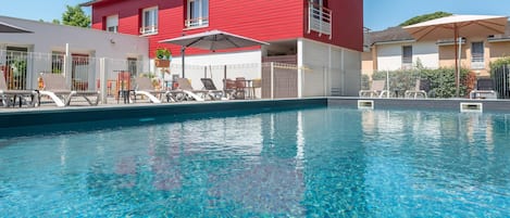 Seasonal outdoor pool, open 10:30 AM to 7:30 PM, pool umbrellas