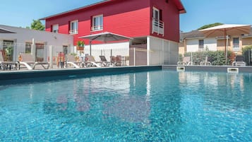 Seasonal outdoor pool, open 10:30 AM to 7:30 PM, pool umbrellas