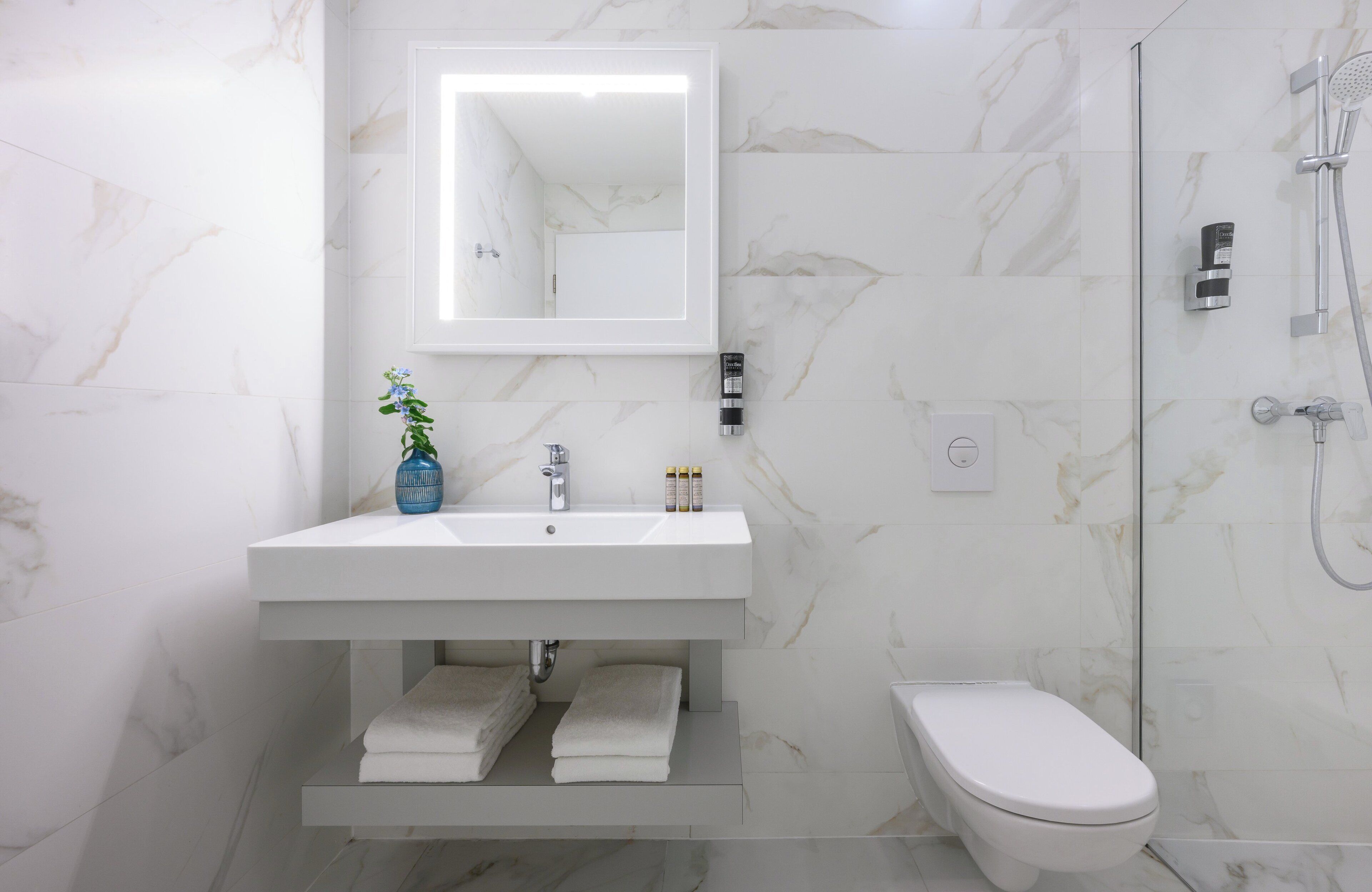 shower, eco-friendly toiletries, hair dryer, towels