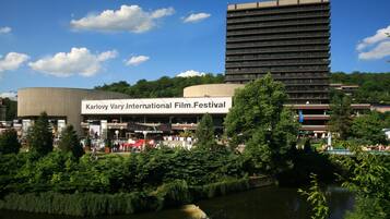 A building with a sign reading "Karlovy Vary International Film Festival".