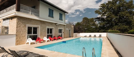 Seasonal outdoor pool, pool umbrellas, pool loungers