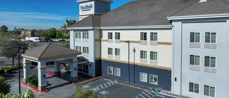 A Fairfield by Marriott hotel with a covered parking area and multiple floors.