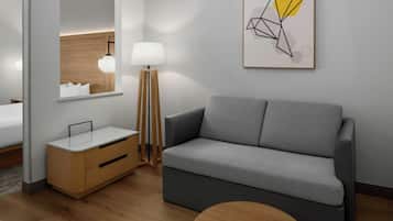 Suite ejecutiva, 1 cama King size y sofá cama | Escritorio, espacio para trabajar con laptop y cortinas blackout