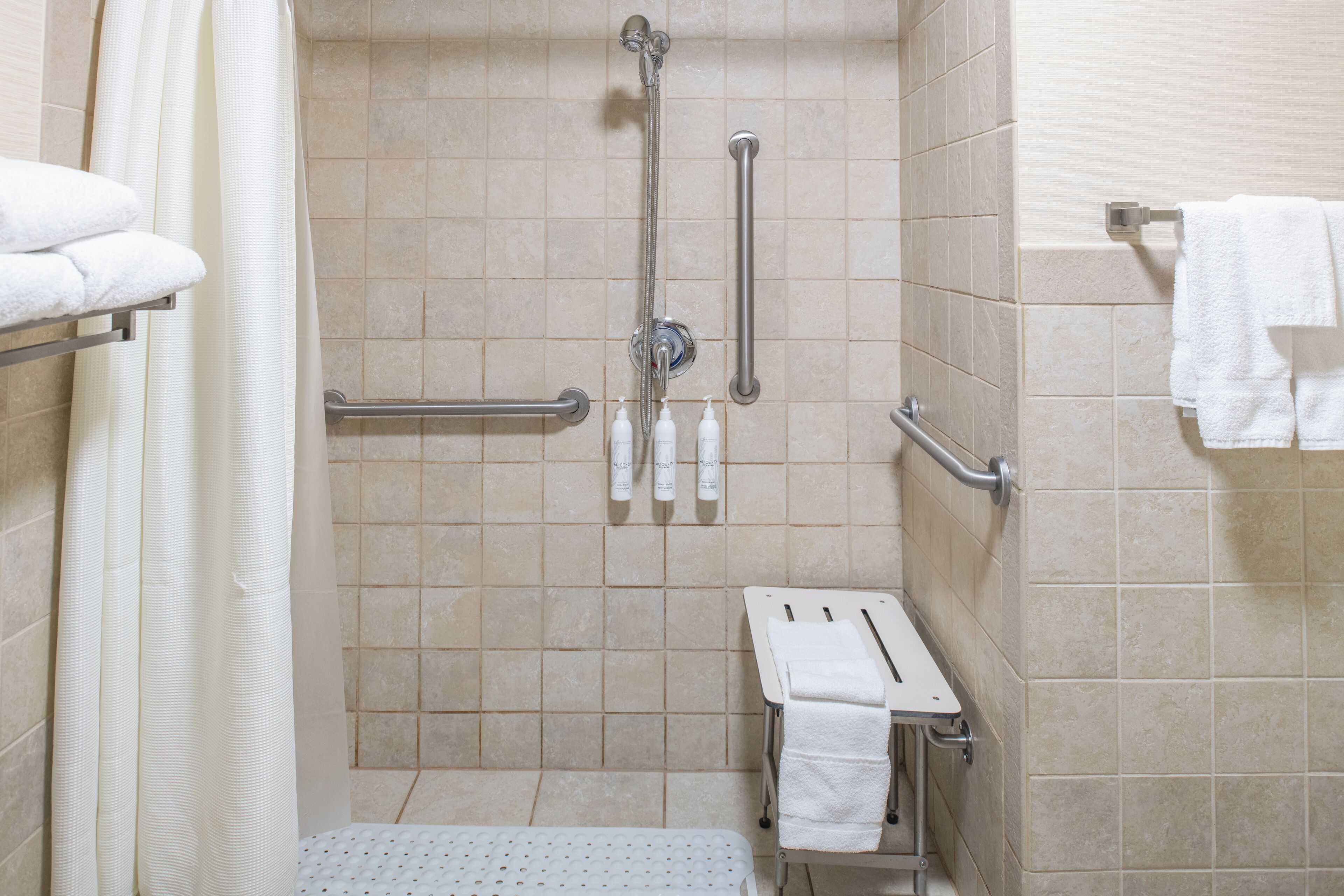 room, 1 king bed (mobility/hearing access, roll-in shwr) | bathroom | combined shower/bathtub, hair dryer, towels