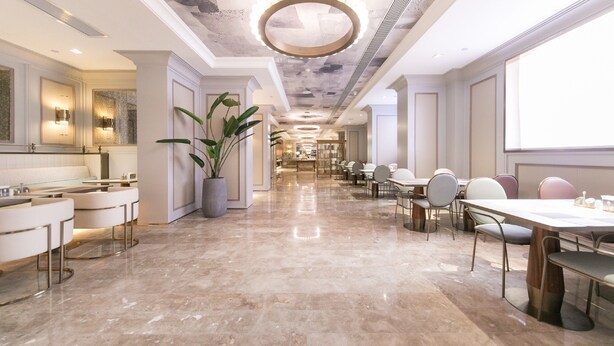A spacious hotel lobby with a marble floor, a large chandelier, and a long reception desk. - Mercure Xi'an Downtown (Xi'an)