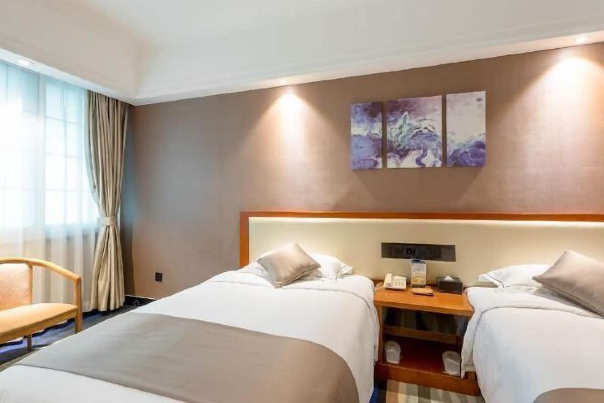 Premium bedding, down duvets, in-room safe, desk