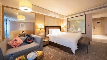 Deluxe-enkeltværelse | Premium-sengetøj, minibar, pengeskab på værelset, skrivebord