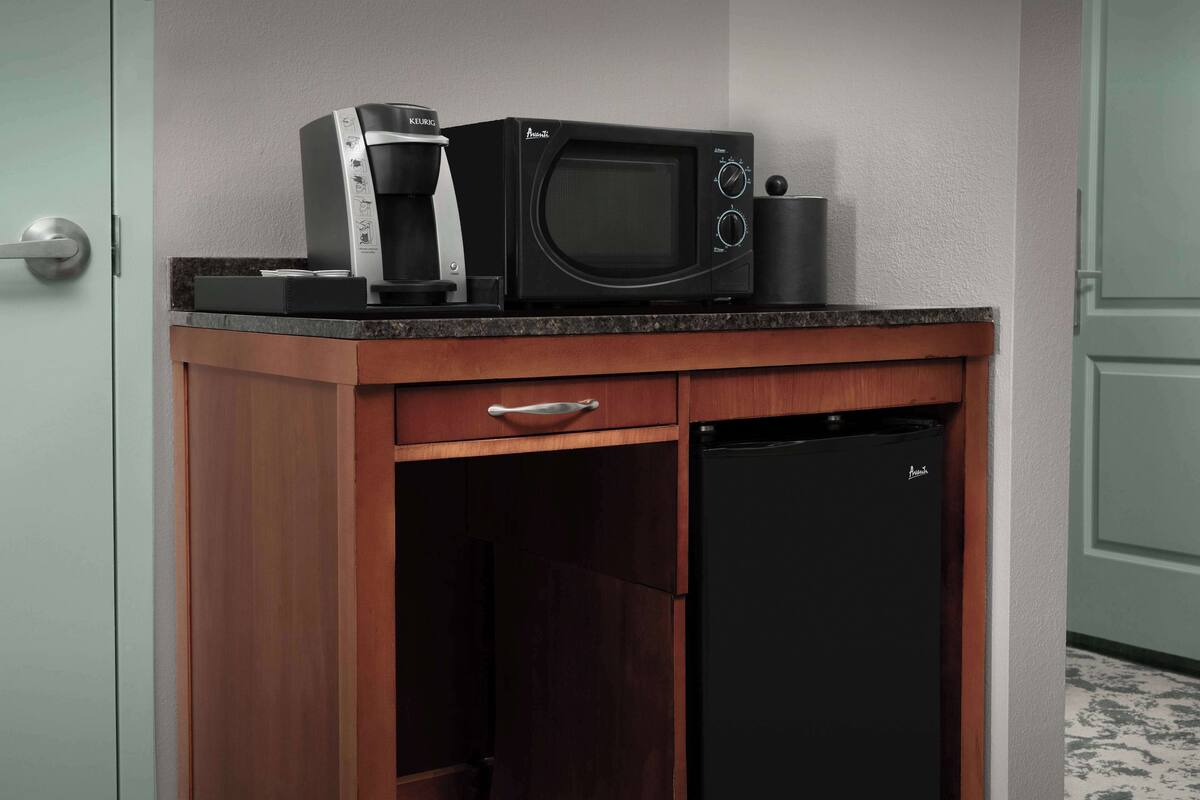 desk, laptop workspace, blackout curtains, iron/ironing board