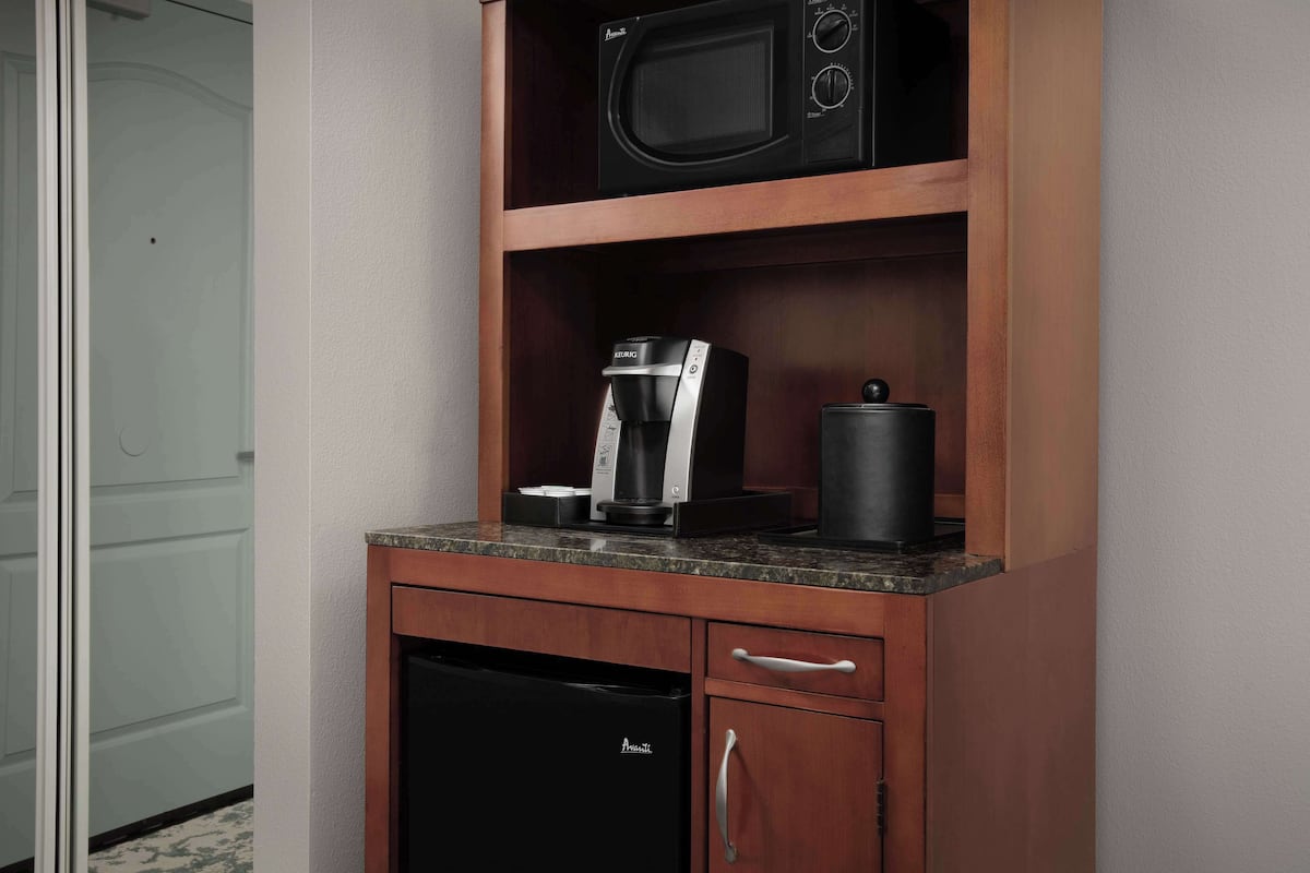 desk, laptop workspace, blackout curtains, iron/ironing board