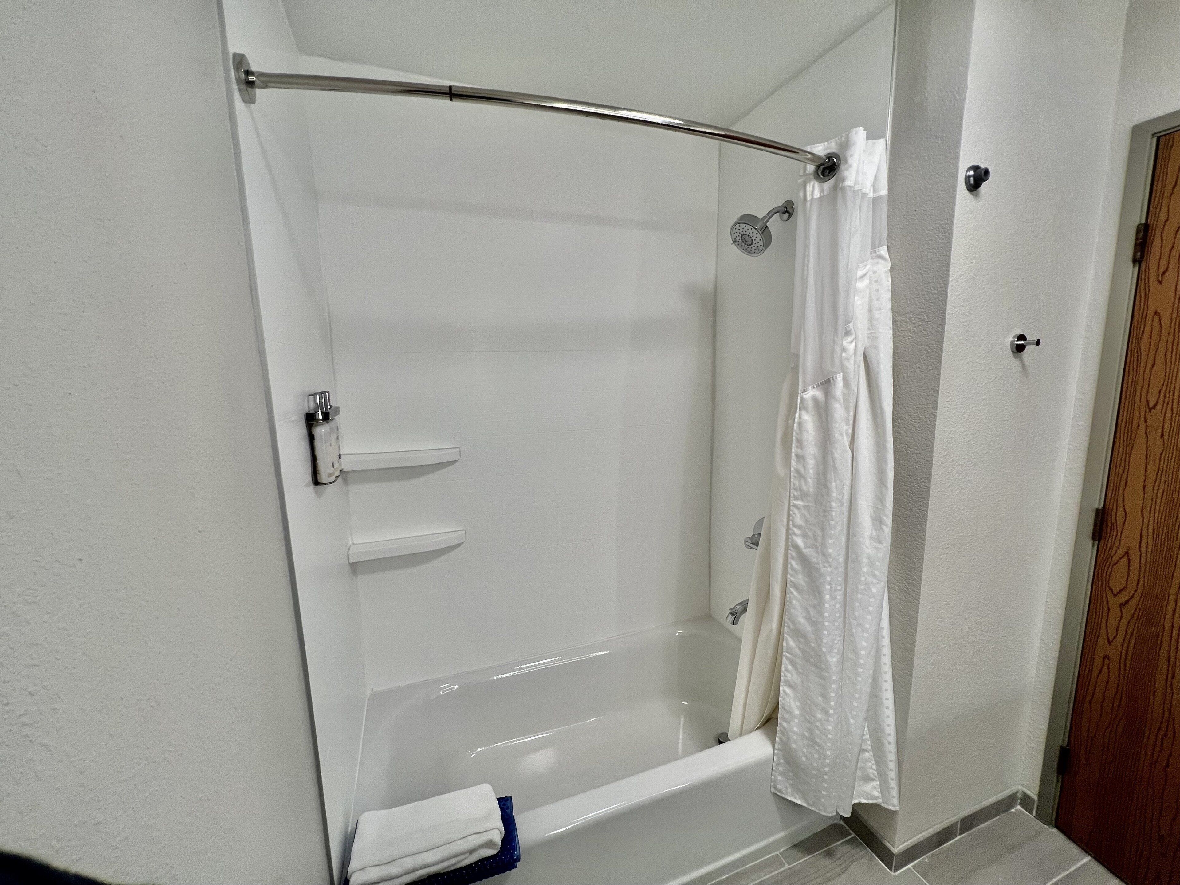 suite, 1 king bed with sofa bed (additional living area) | bathroom | combined shower/bathtub, free toiletries, hair dryer, towels