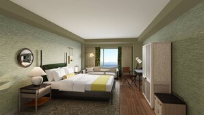 A hotel room with a bed, bedside tables, a chair, a small table, a TV, and a view of the outdoors. - The Harborvale, Autograph Collection (Burlington)